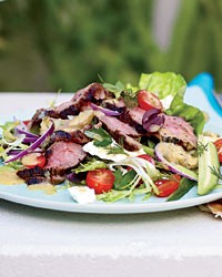 Warm lamb salad with fresh herbs, feta and artichokes