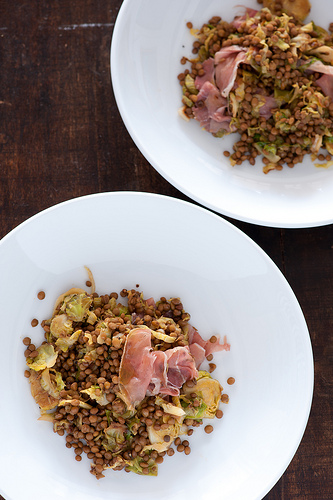 Warm lentils with Brussels sprouts prosciutto