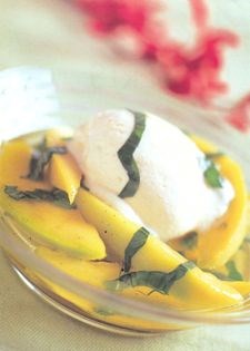 Warm mango compote with basil and vanilla ice-cream