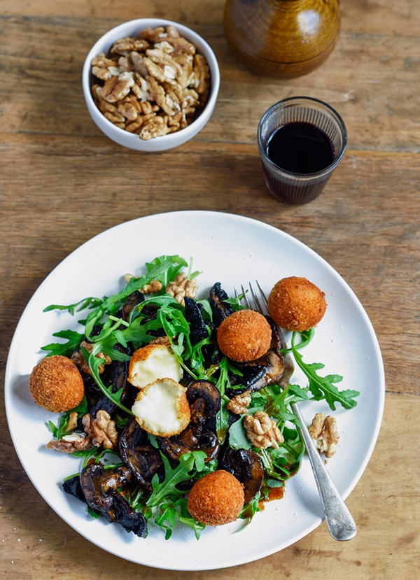 Warm mushroom salad with Parmesan cheese balls and walnuts