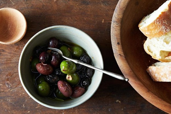 Warm olives in anchovy oil