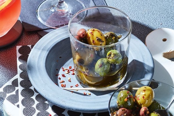 Warm olives with vermouth, slow-cooked herbs and chilli