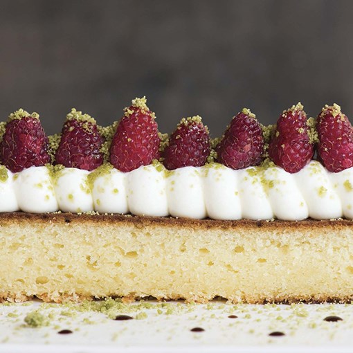 Warm Parmesan pound cake with whipped mascarpone, raspberries, and basil sugar