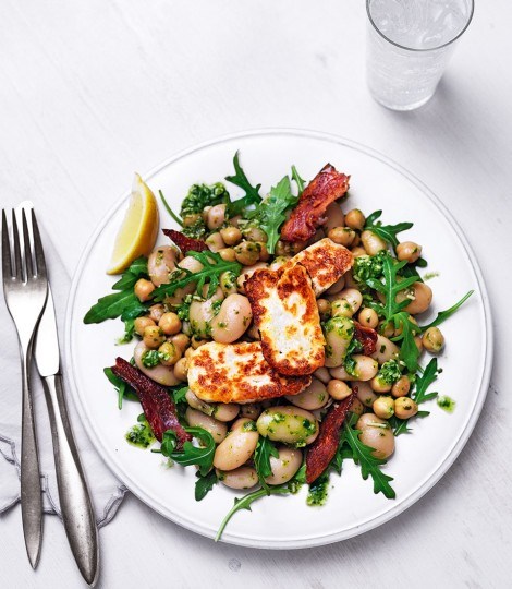 Warm pesto, chickpea and butter bean salad with bacon and grilled halloumi