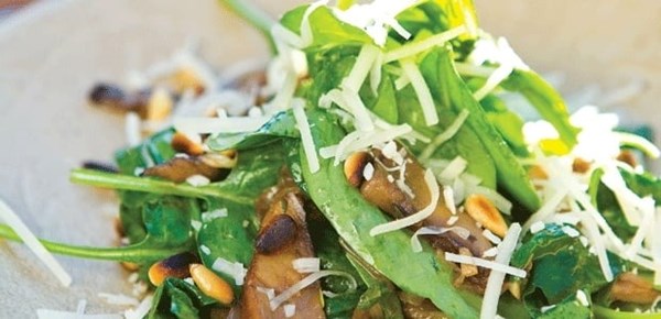 Warm portobello mushrooms with spinach, pine nuts & caramelized shallots