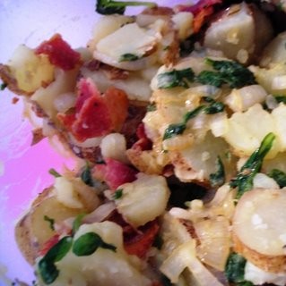 Warm potato salad with bacon and spinach
