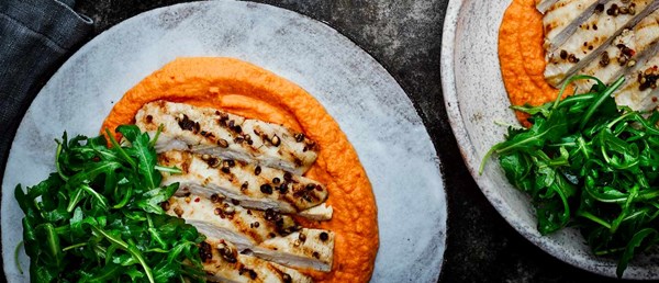 Warm red pepper hummus with coriander chicken breasts