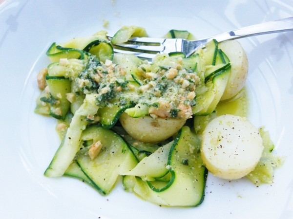 Warm ribbon courgette & potato salad with pesto