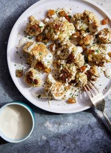 Warm roasted cauliflower with tahini-yogurt dressing