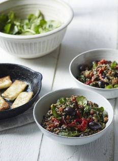 Warm roasted pepper and lentil salad with olives and halloumi
