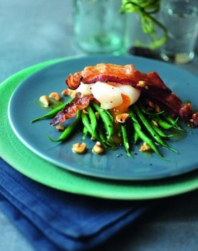 Warm salad of French beans and bacon with poached duck egg and hazelnut butter dressing
