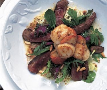 Warm salad of seared scallops with wild mallard duck, orange, honey and grainy mustard dressing