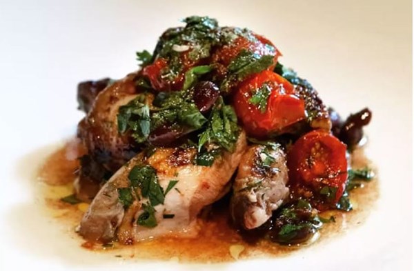 Warm salad of wood-fire grilled quail with smoky tomato &  black olives