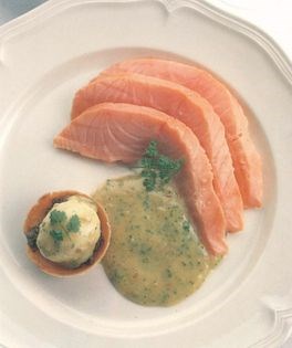 Warm smoked salmon with chervil butter sauce garnished with a tart of softly boiled quail’s egg