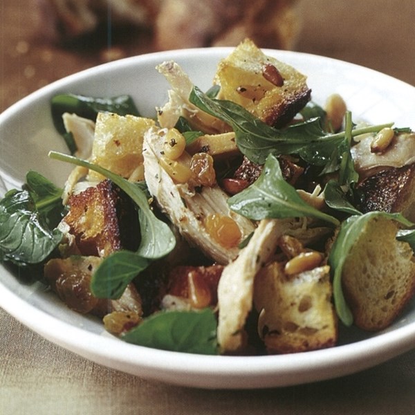 Warm sourdough bread salad with chicken and pine nuts