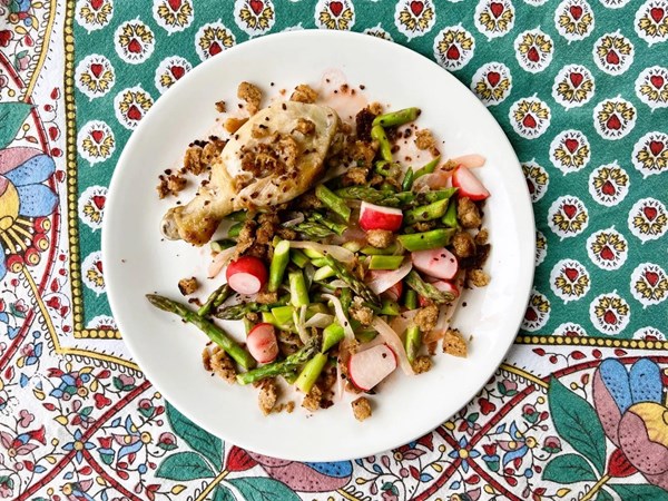 Warm spring vegetable salad with fish and crisp croutons