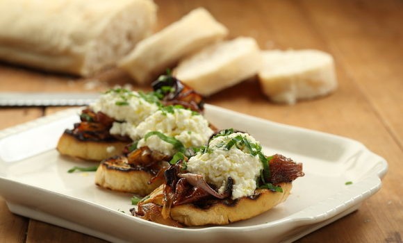 Warm verjuice ricotta on ciabatta with slow roasted onions