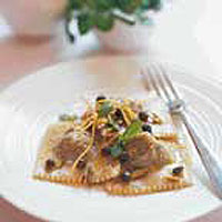 Watercress and pistachio ravioli with lemon and oregano oil