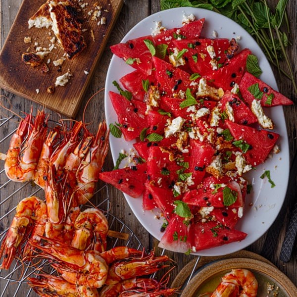 Watermelon, mint and barbecue feta salad with grilled king prawns