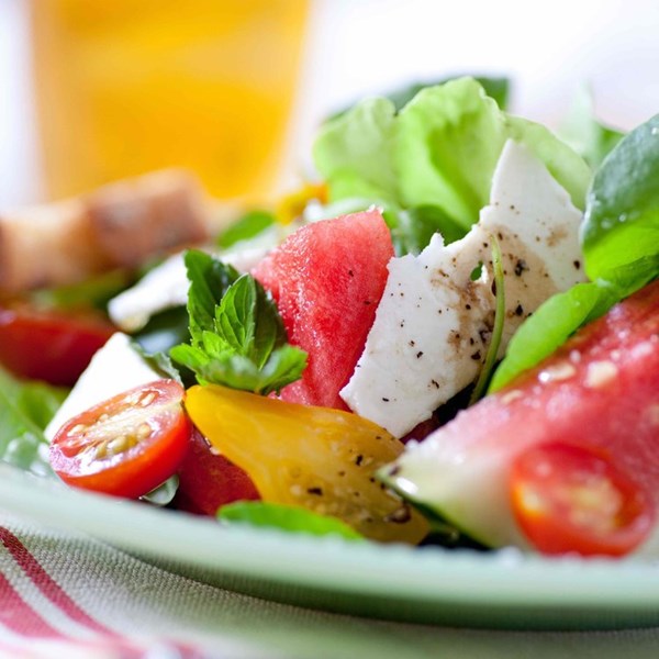 Watermelon-tomato salad with shaved feta and handfuls of mint