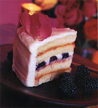 Wedding cake with blackberries and roses