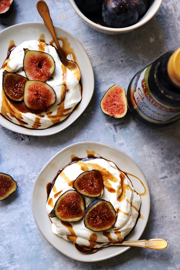 Whipped almond yogurt cream with figs and balsamic syrup