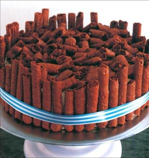 Whipped cream-covered chocolate chestnut cake