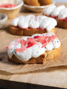 Whipped preserved lemon chèvre toast with pickled radish and sumac