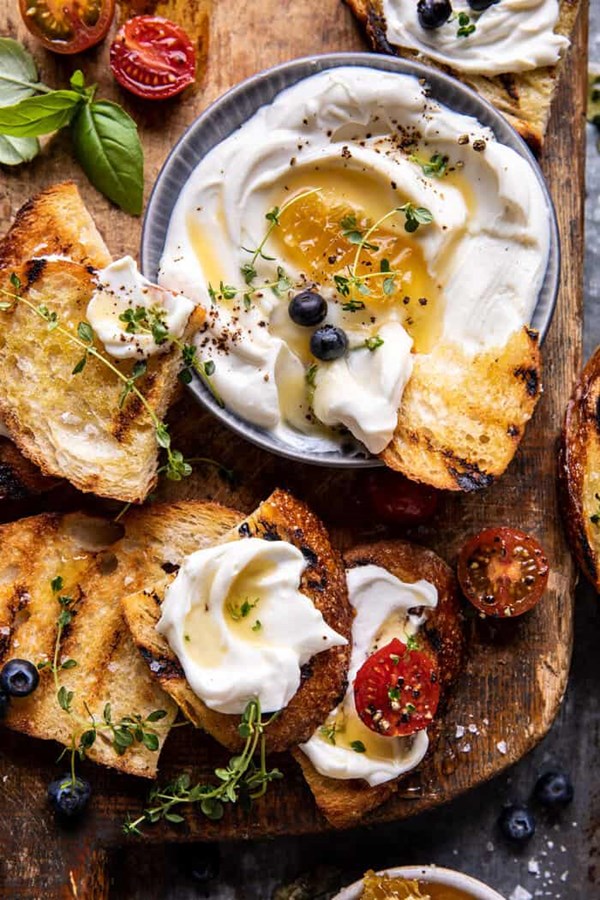 Whipped ricotta toast with marinated tomatoes and lemon thyme honey