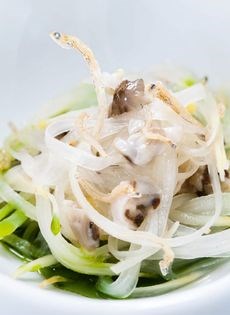 White asparagus in miso with oysters, cucumber oil, and small fish