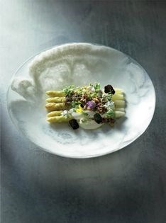 White asparagus with Comte-infused milk curd, roasted nuts and herb flowers 