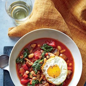 White bean and vegetable bowls with frizzled eggs