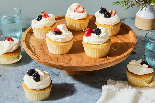 White cake cupcakes with mascarpone whipped cream & berries