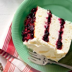 White cake with cranberry filling and orange buttercream
