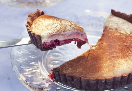 White chocolate and raspberry tart with a cocoa crust