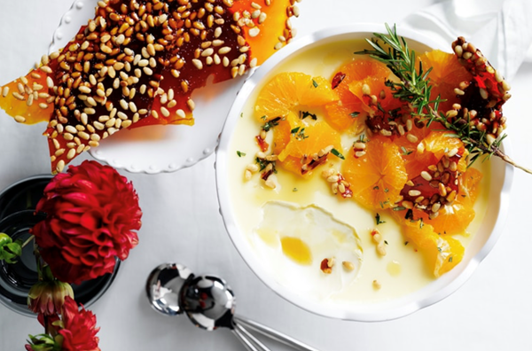 White chocolate and rosemary panna cotta with pine nut praline and orange