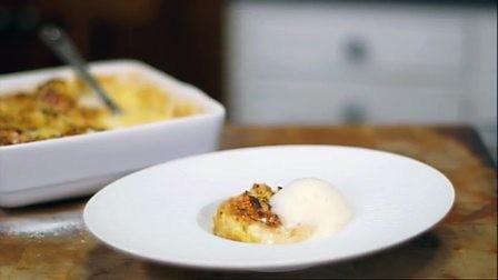 White chocolate and whisky croissant pudding with honeycomb foam and whisky ice cream