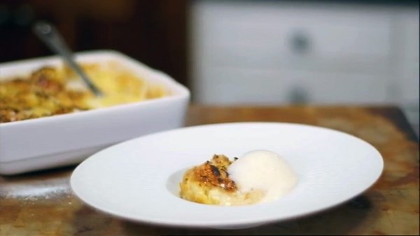 White chocolate and whisky croissant pudding with honeycomb foam and whisky ice cream