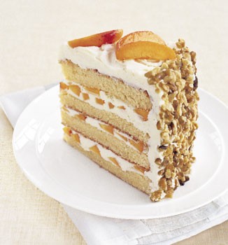 White chocolate layer cake with apricot filling and white chocolate buttercream
