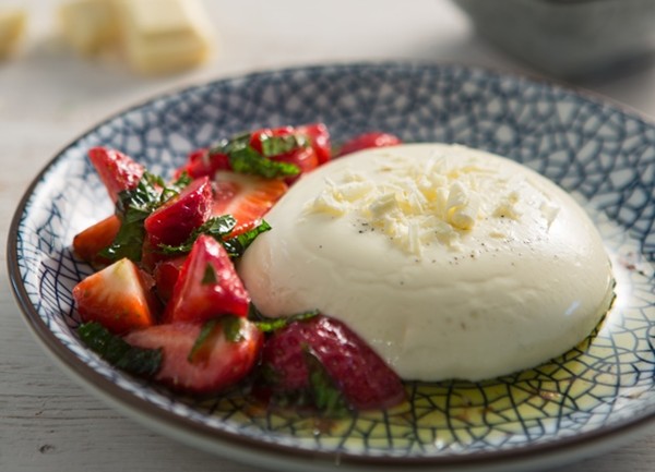 White chocolate panna cotta with lemon, mint and olive oil strawberries