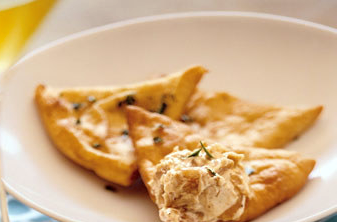 White four-cheese pizza with basil and garlic
