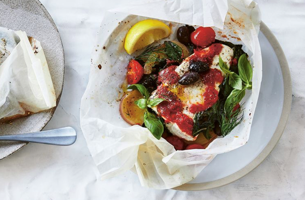 White wine, tomato and olive fish in a bag