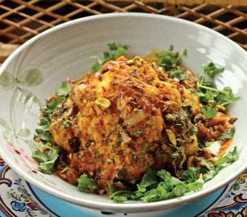 Whole backed cauliflower in tomato mint sauce (Phoolgobi moghlai)