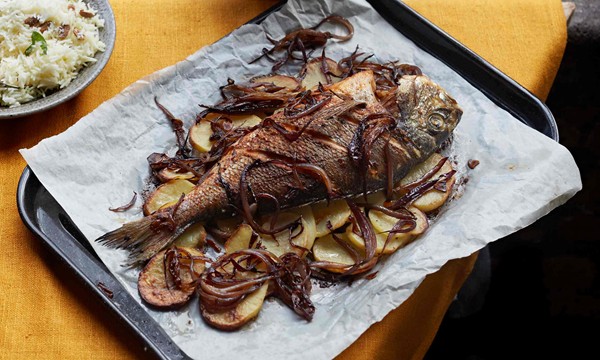Whole baked sea bream with red onions