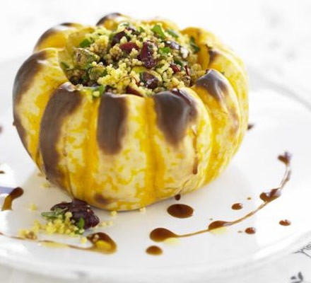 Whole baked squash with spiced couscous