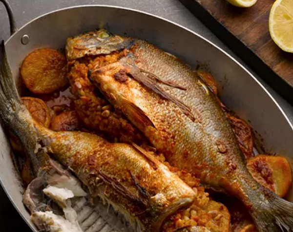Whole black bream with pine nuts and lemon