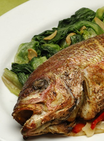 Whole fish roasted with fennel, olives, and chilies (Psari psito)