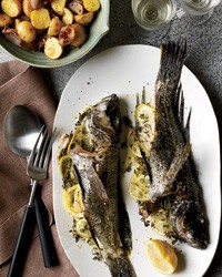 Whole fish roasted with potatoes and thyme