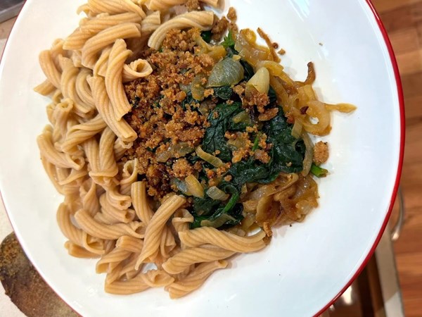 Whole grain pasta with onion, breadcrumbs, and something else 