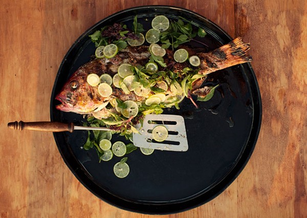 Whole grilled fish with lime
